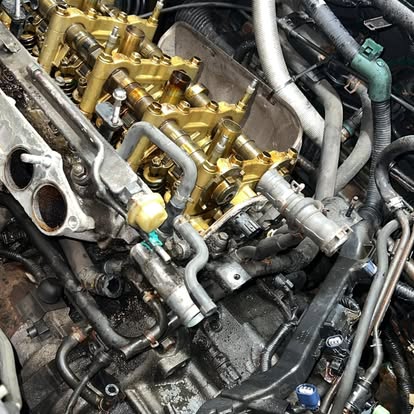 Engine bay work — intake off, deep in it